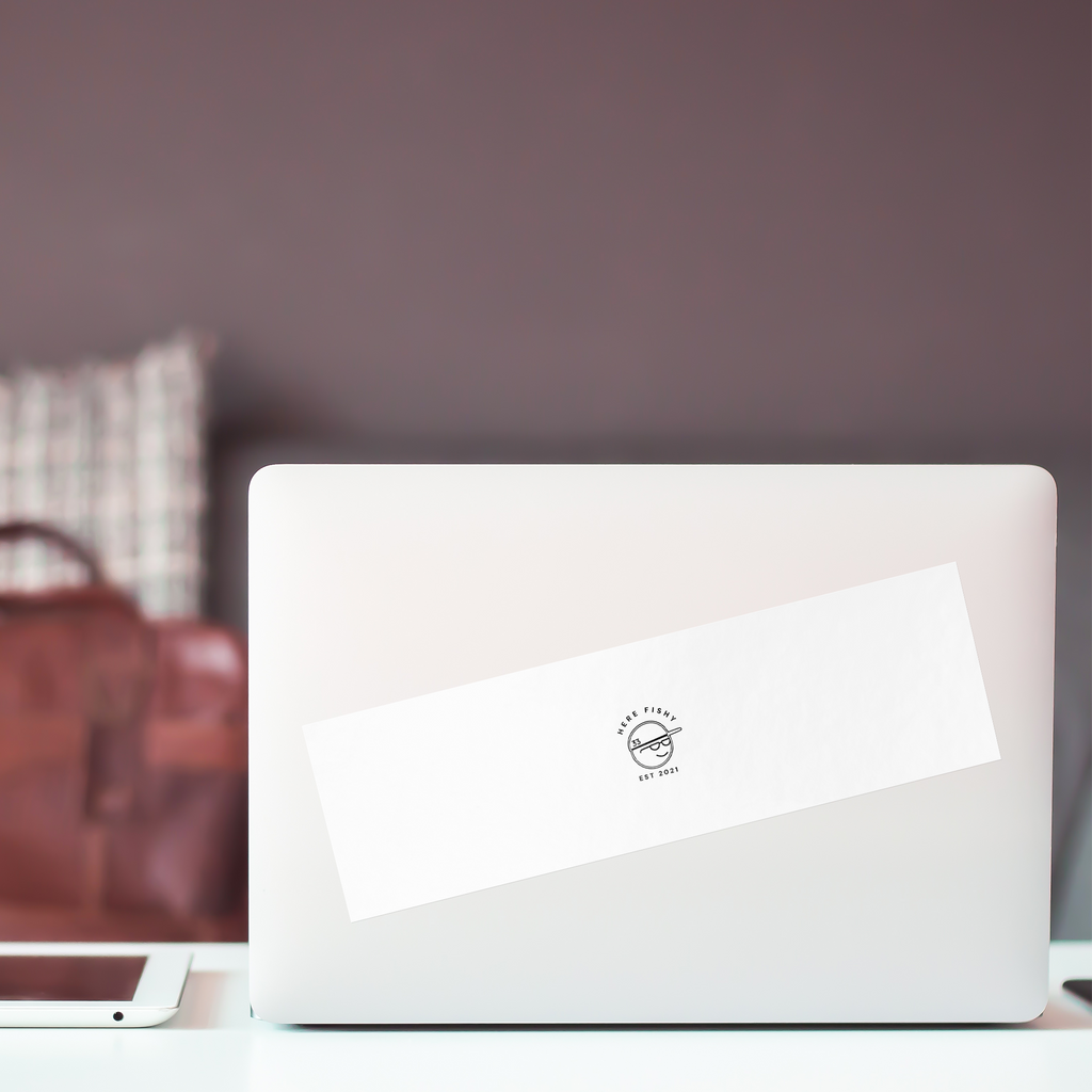 Here_Fishy_Bumper_Sticker_WhiteBumperSticker-Laptop_Mockup.png_15756692